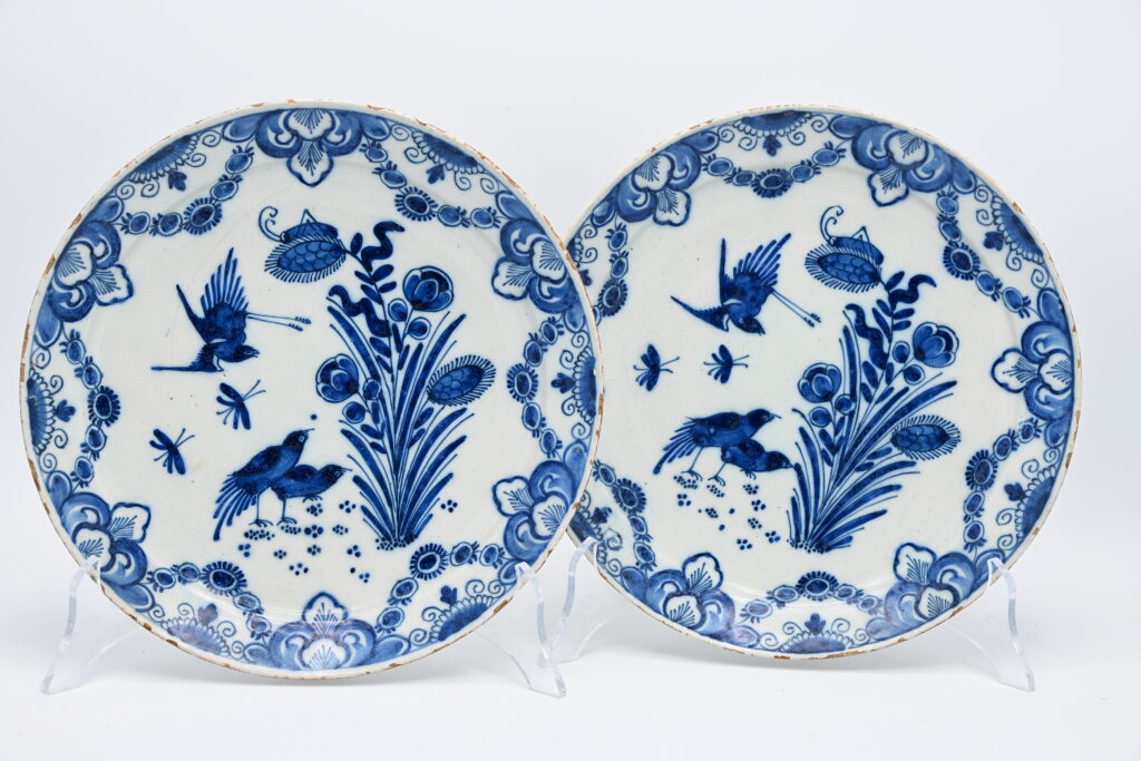 Excellent pair of mid 18th century Delftware plates with fine decoration of birds and flowers. Border adorned with foliage scrolls. Marked IVL for Johannes and Margaretha van Lockhorst-van der Gucht, owners of De Klaauw, 1713-1740