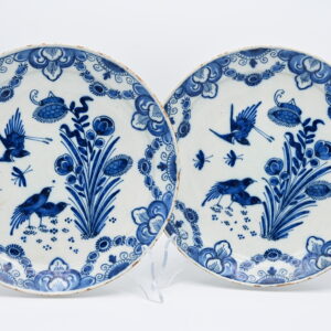 Excellent pair of mid 18th century Delftware plates with fine decoration of birds and flowers. Border adorned with foliage scrolls. Marked IVL for Johannes and Margaretha van Lockhorst-van der Gucht, owners of De Klaauw, 1713-1740