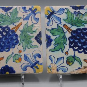 Polychrome Delft Tiles (pair) with grapes, early 17th centuryPolychrome Delft Tiles (pair) with grapes, early 17th century